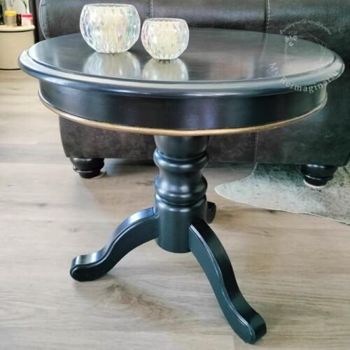 Round black coffee table upcycled and repainted in Artisan furniture paint in the colour Jet.