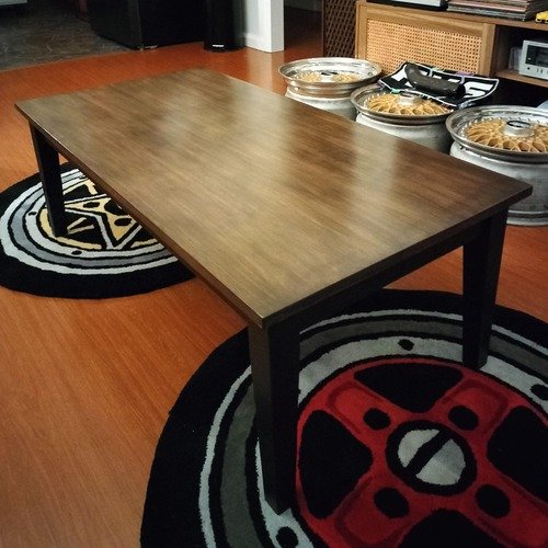 Solid timber coffee table repainted in Artisan mineral paint in Jet with a walnut stained table top